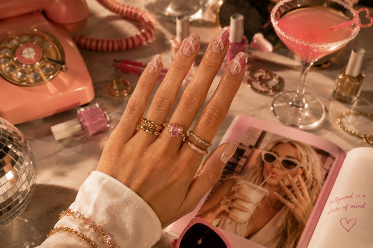 Nude almond manicure with fine metallic detail