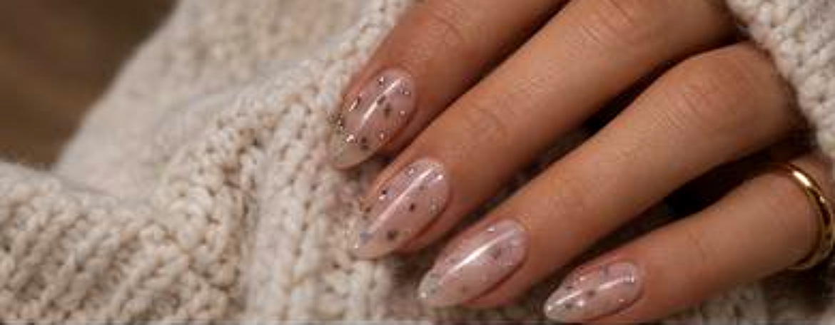 Soft nude rhinestone manicure with balanced detail