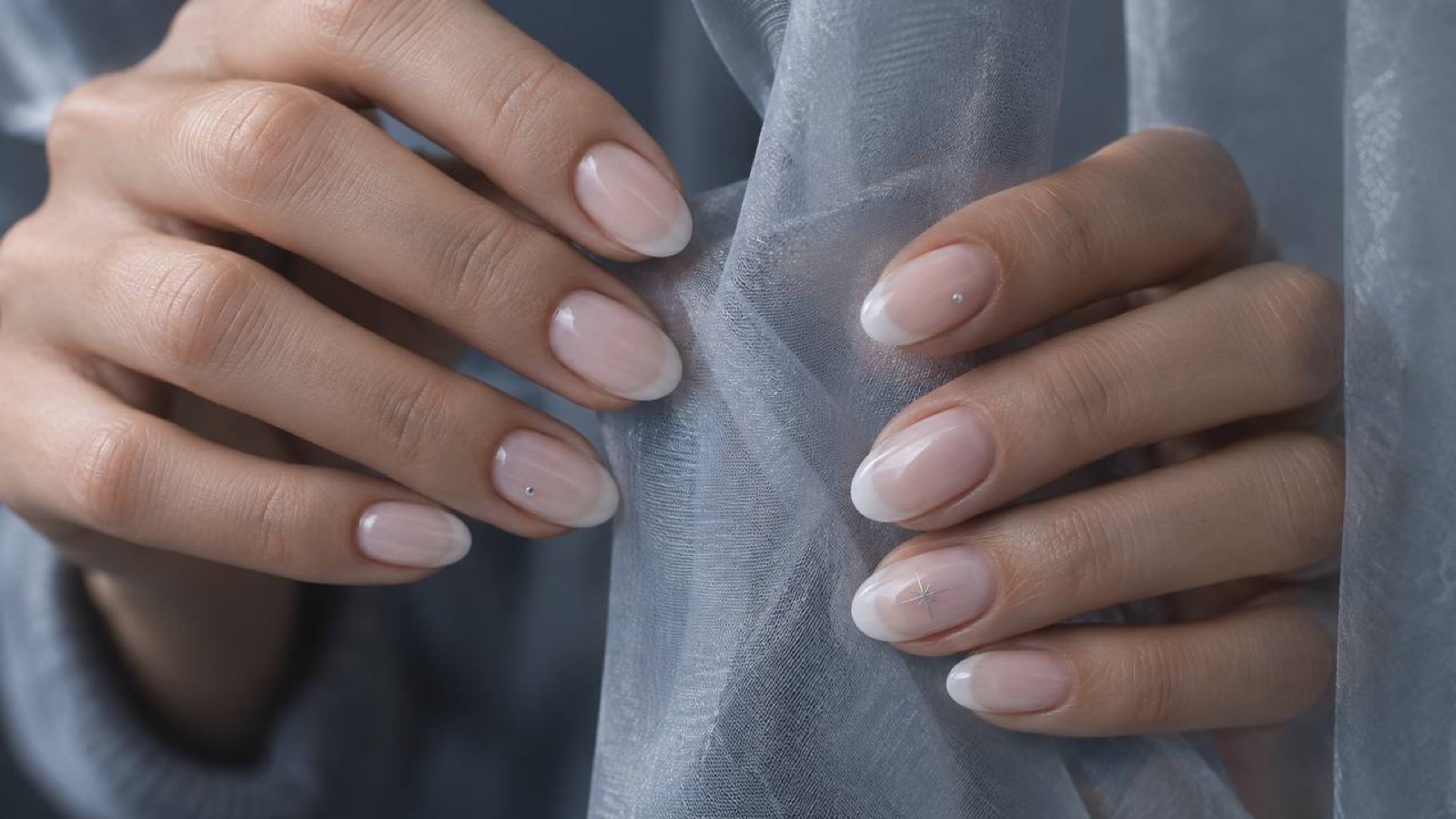 Cloudy French manicure with soft blurred tips and tiny reflective details